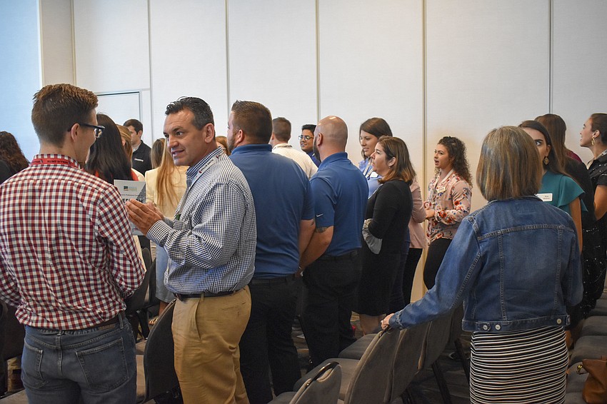 The summit attendees converse about what makes them excited in life during AJ Lee's keynote address.