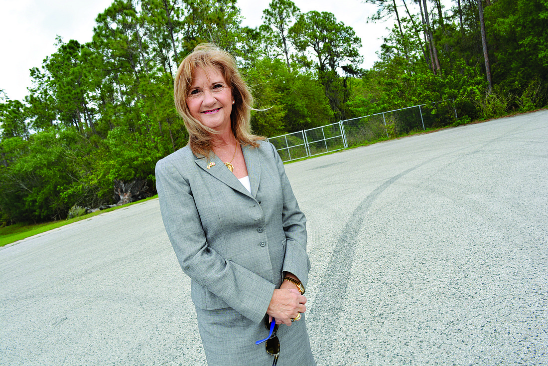 Manatee County Commissioner Vanessa Baugh, standing at Lena Road, where it terminates heading north from State Road 64, hopes the county can speed up plans for its construction. File photo.