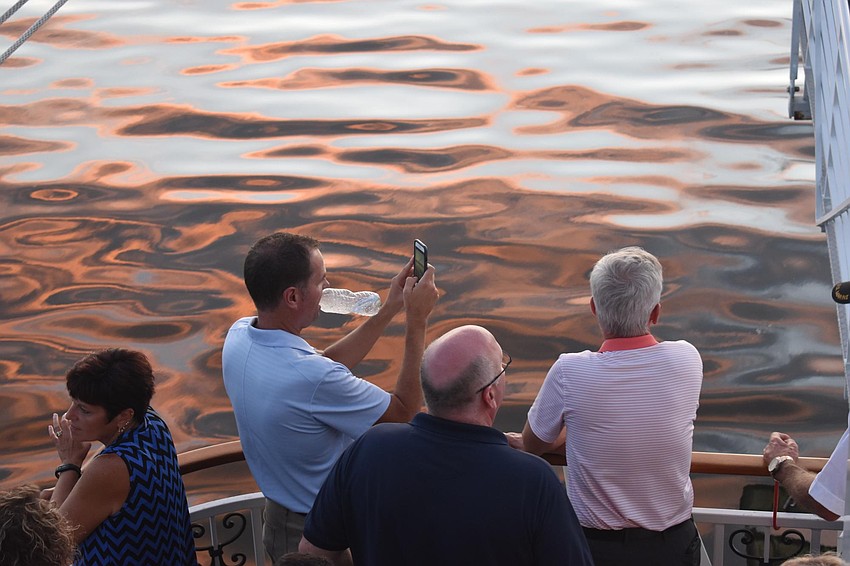 People gathered outside to snap the sunset.