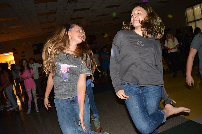 Seventh-graders Skylar Zadai and Brooklyn McCutchan dance the 