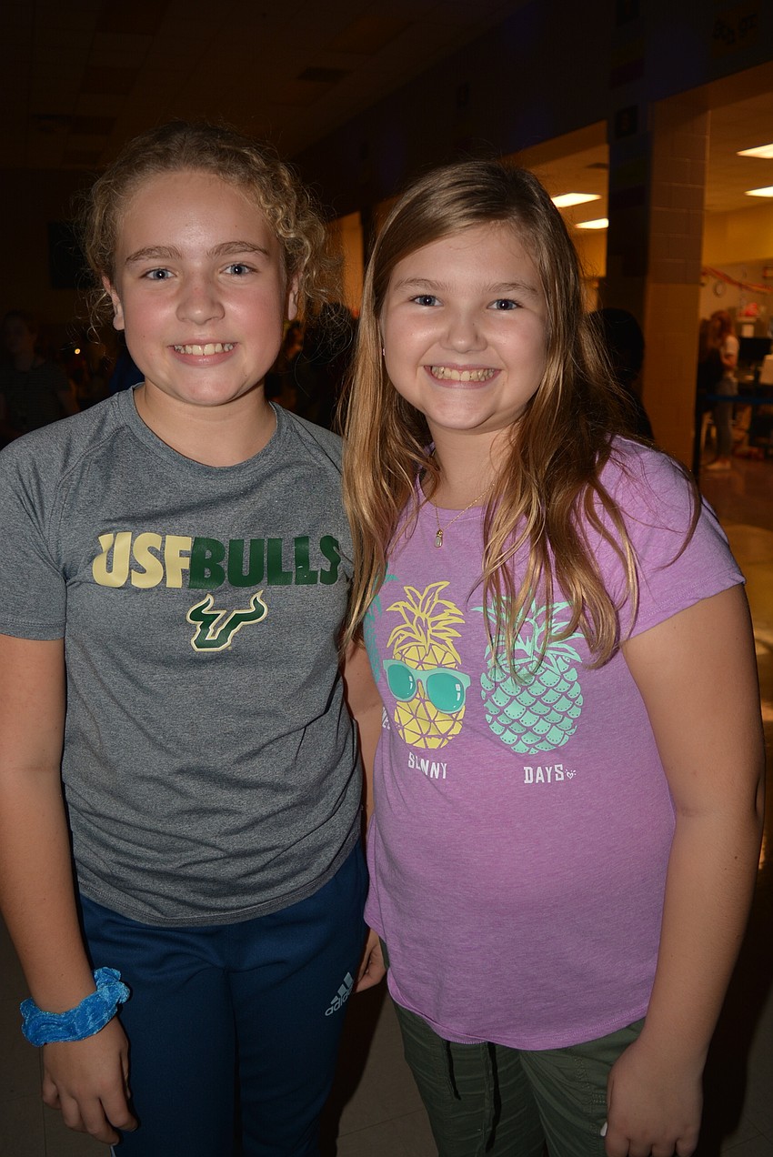 Sixth-graders Jill Leonardis and Brittney Peterson say the music is the best part of the event.
