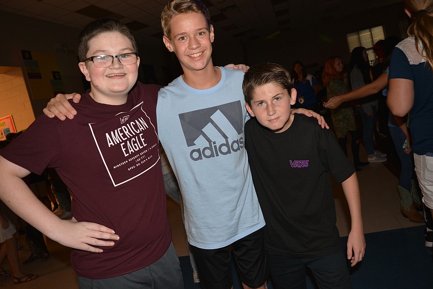 John Kelly, Jake Gillson and Brady Wilson are seventh-graders but they hadn't been to the dance before.