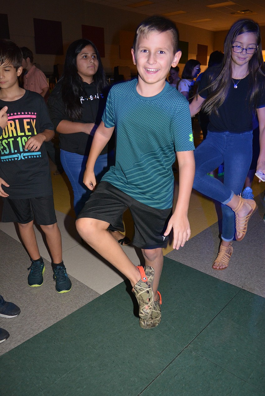 Eleven-year-old Trent Boldin is on the front row dancing to 