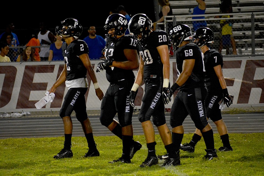 The Pirates walk off the field following the 7-2 loss.