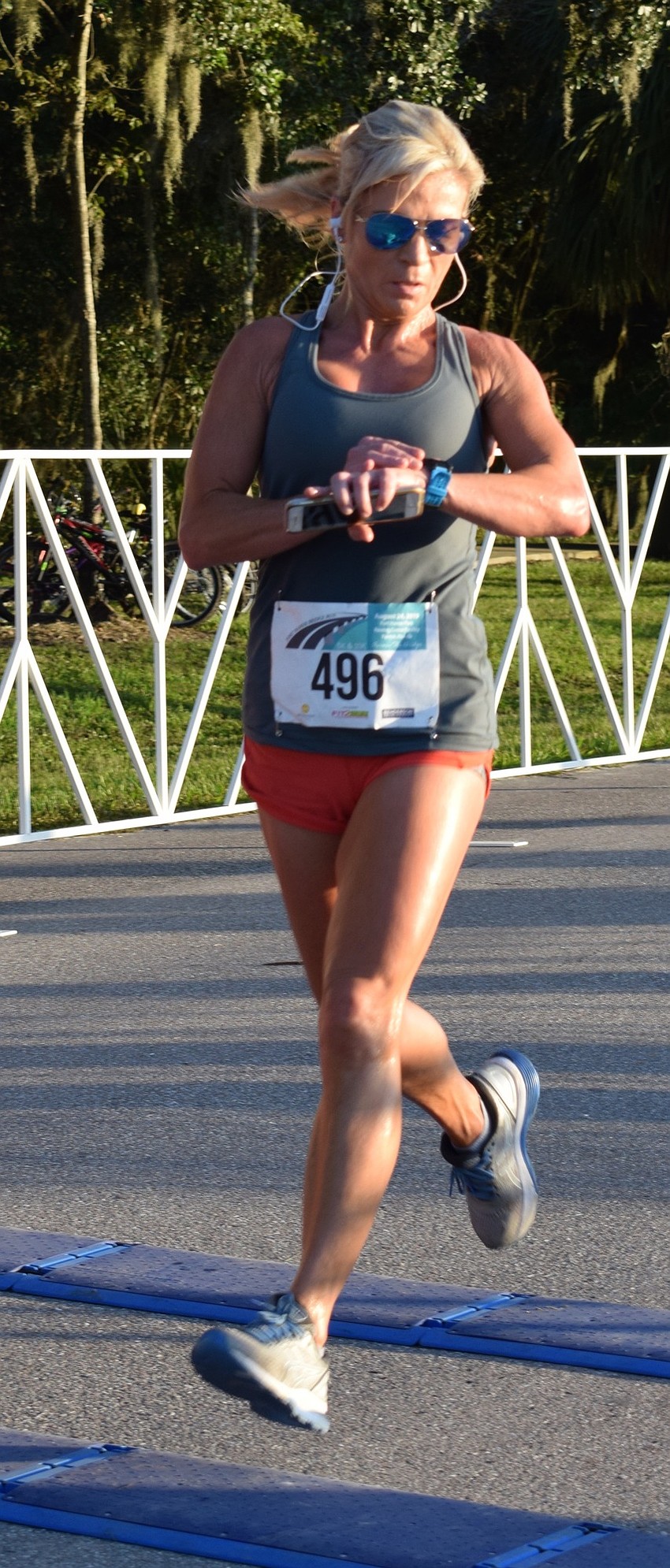 Bradenton resident Cordie Hentges crosses the finish line of the Fort Hamer Bridge Run.