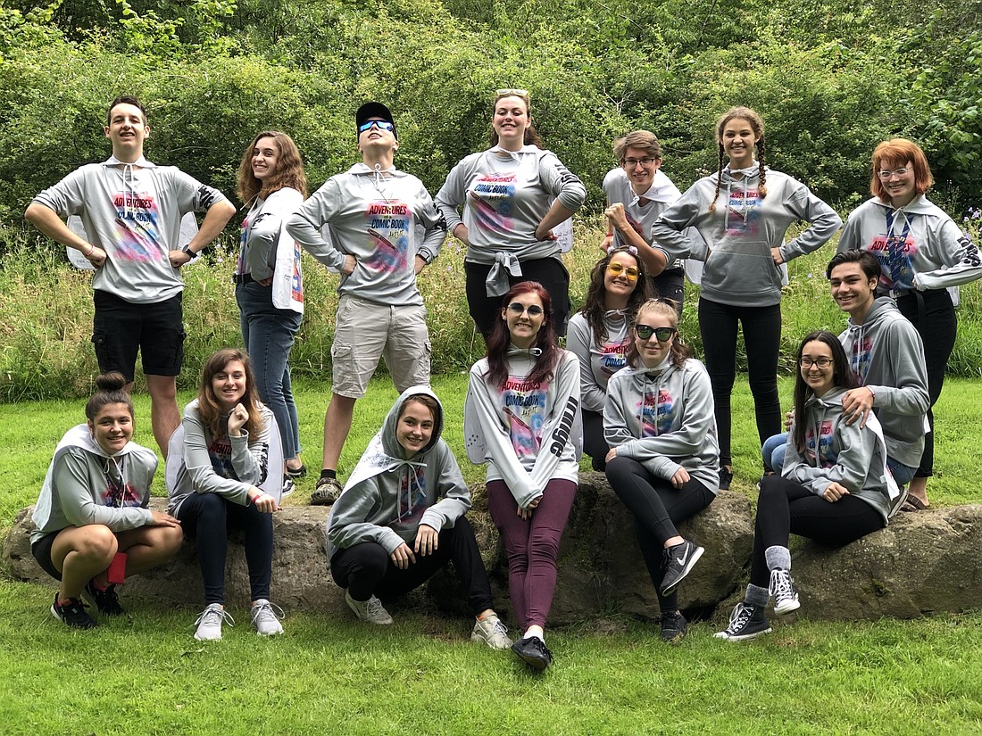 The cast and crew of Lakewood Ranch High School&#39;s "Adventures of a Comic Book Artist" take photos to commemorate their trip to Scotland for the Edinburgh Festival Fringe.