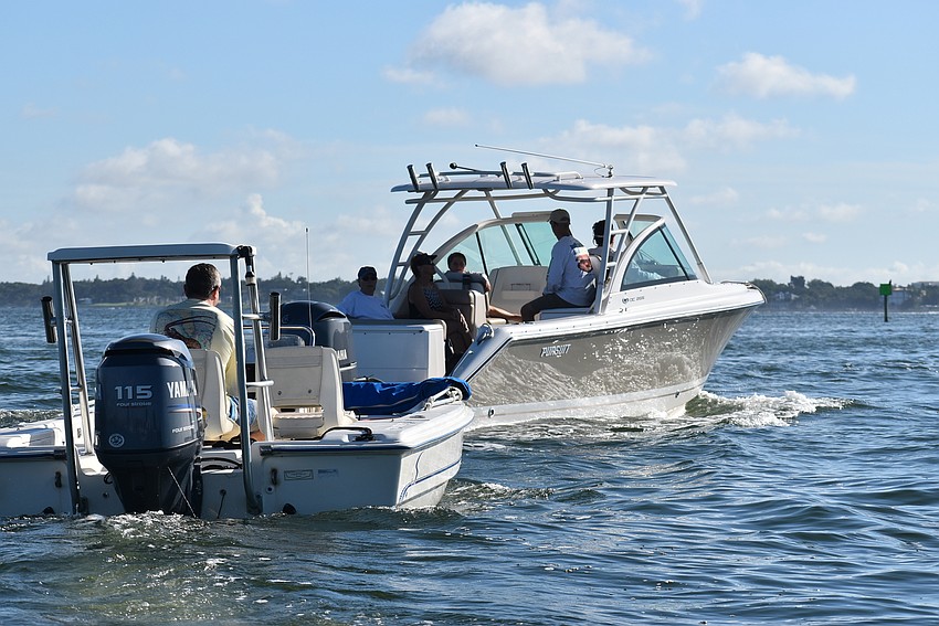 Boats head out to the bay.