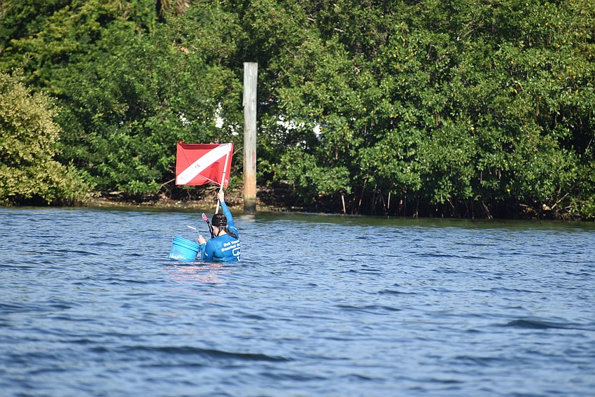 Jeanette Marks takes her dive flag out far.