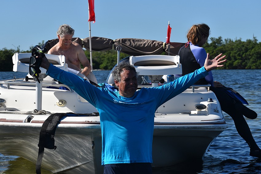 Ernesto Lasso de La Vega hops into the water.