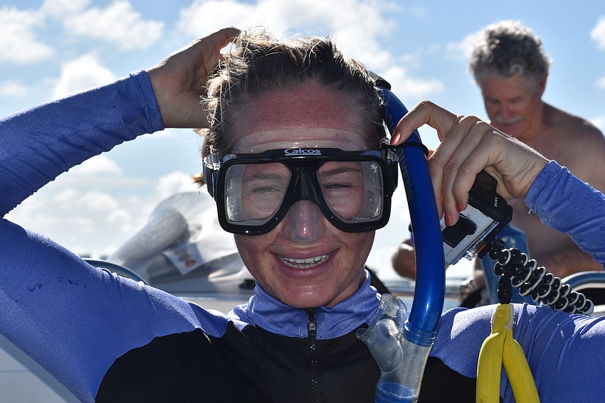 Martha Robinson adjusts her mask.