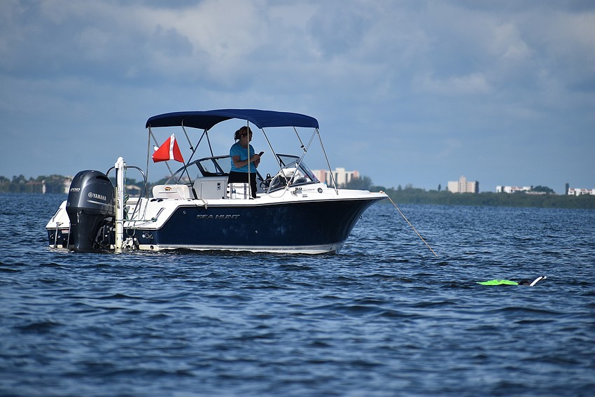Cynthia Collawn stays onboard to record her crew's observations.