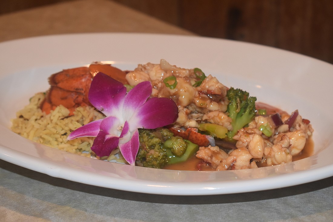 The general tso lobster dish is loaded with vegetables and rice to swirl in the sauce.