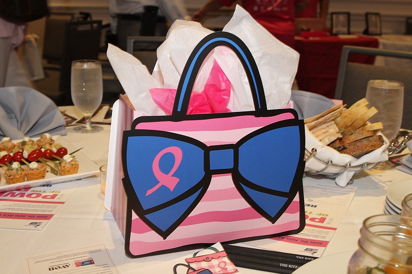 Each table featured a pink gift bag,