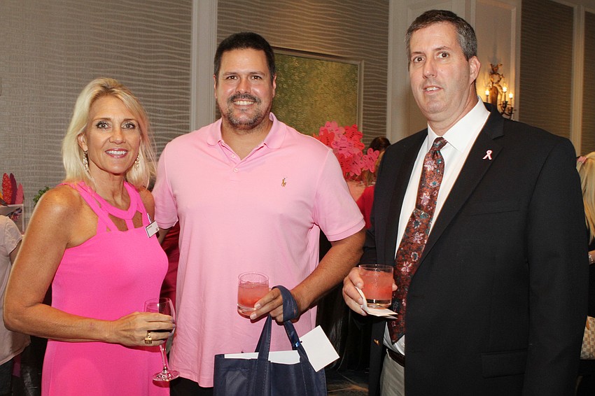 Real Men Wear Pink Co-Chairwoman Joy McLean with participants Chip White and Byron Diamond