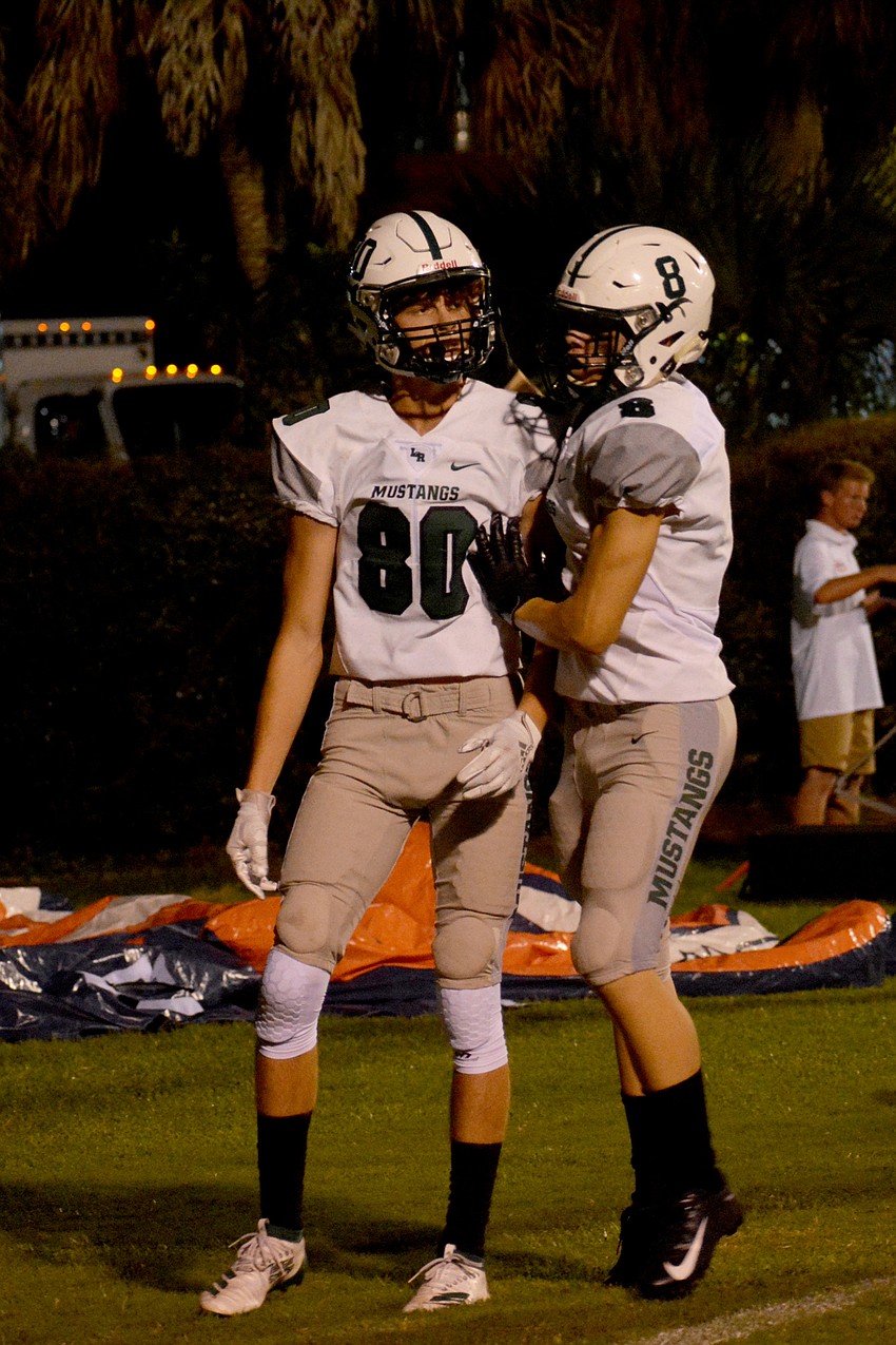 Lakewood Ranch senior Michael Cucci is greeted by junior wideout Chris Meegan after scoring his second touchdown of the game.