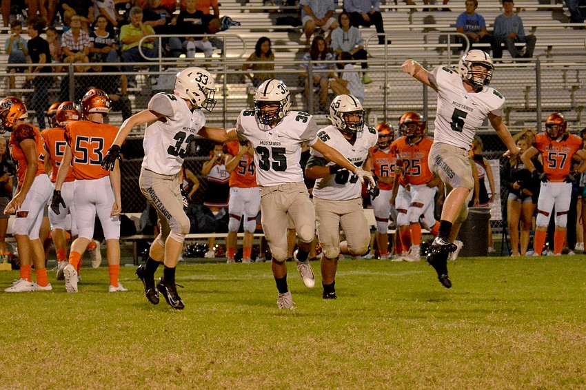 The Lakewood Ranch special teams unit celebrates after forcing a Lemon Bay fumble on a second quarter kickoff.