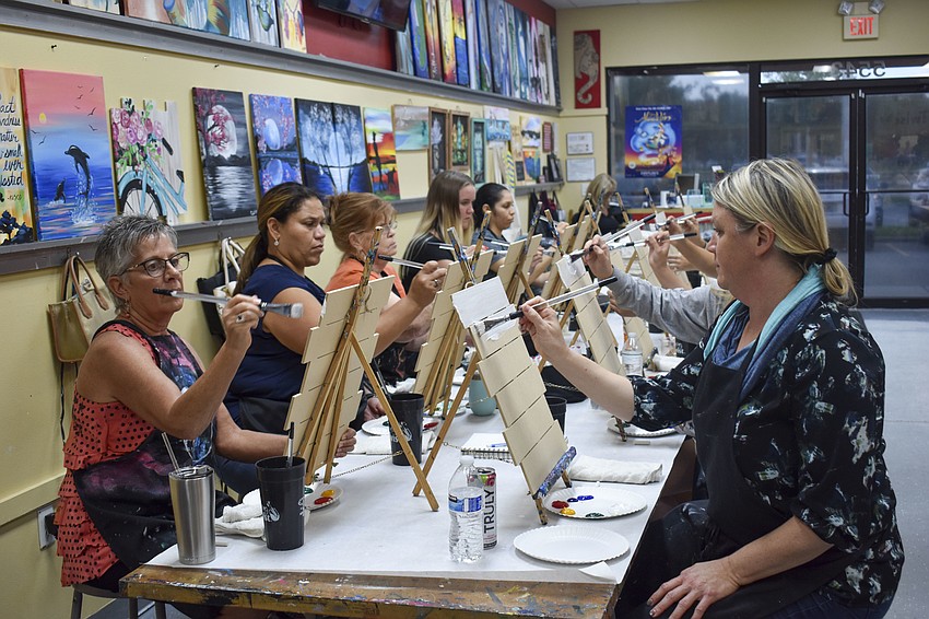 Painters could choose to paint a wine glass or a wood surface cutout.