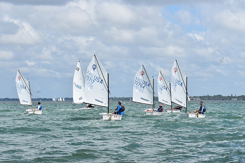 Boats gather near their racecourse.