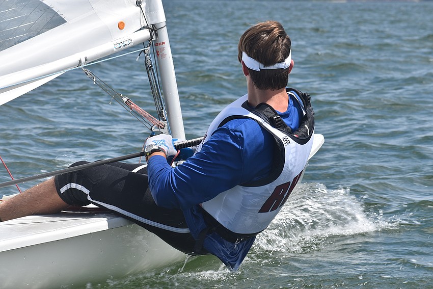 Peter Eberley leans out on his trapeze.