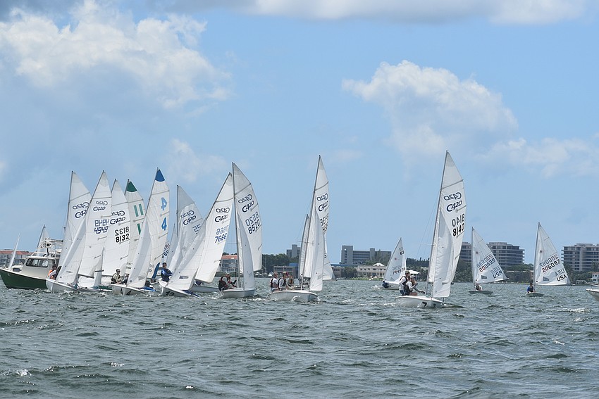 Boats line up at their starting line.