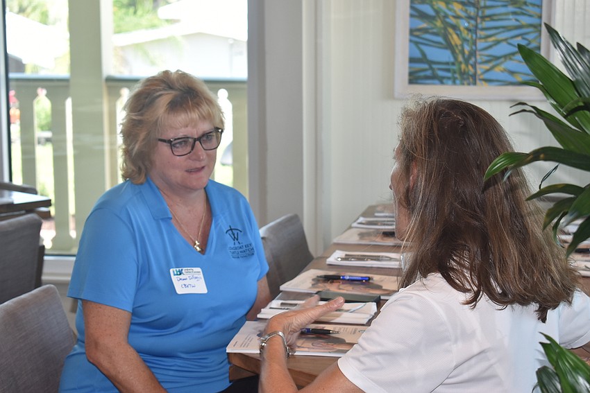 Dawn DiFoggio and Cyndi Seamon mingle at the event.