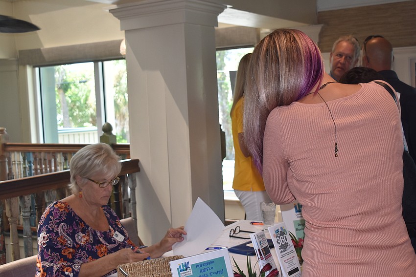 Donna Blaney signs in Missy Ordiway.