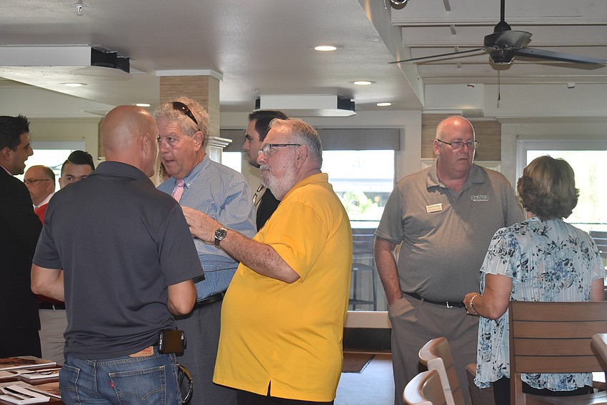 Attendees mingle before lunch.