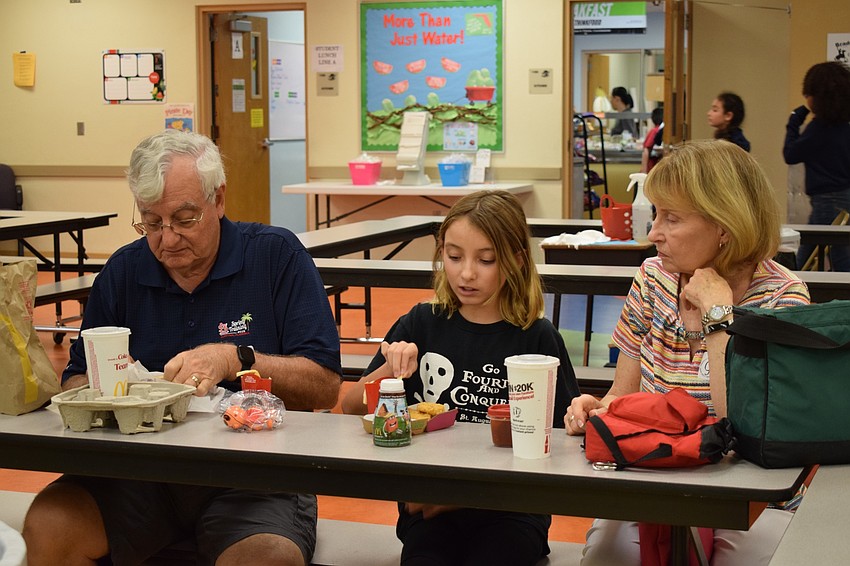 Dave and Arlene Raterman eat lunch with their granddaughter Reese Gurski, who is a 10-year-old fifth-grader at Braden River Elementary School. The Ratermans were at the school to have lunch with three grandchildren.