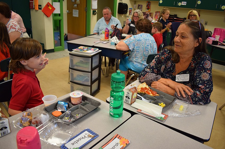 Braden River Elementary School second-grader Ashton Desear, 7, asks his grandmother Brenda Thompson if he can go to the cafeteria to get a spoon. Desear said it was 