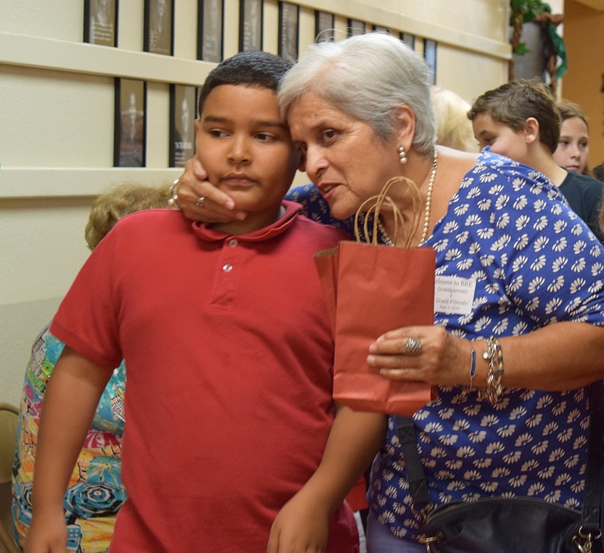 Margarita Sanchez greets her grandson Adrian Echenque, who is a 10-year-old fifth-grader at Braden River Elementary School. The two then went to a classroom to have lunch together.