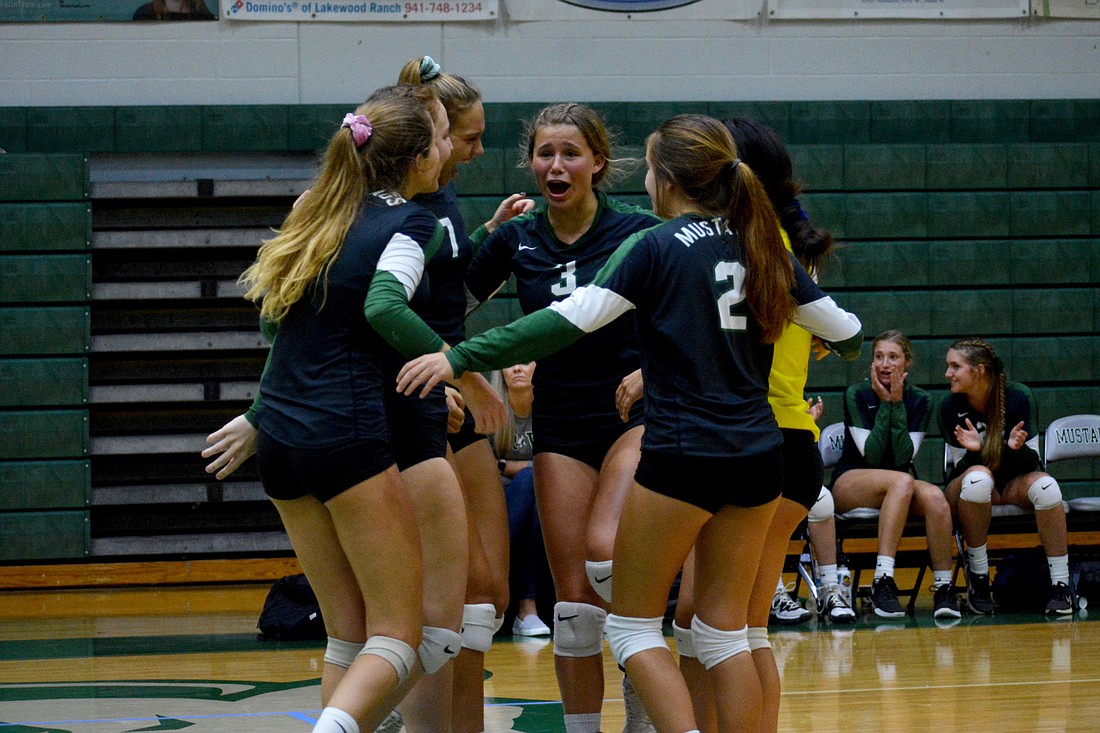 Lakewood Ranch sophomore setter Mackenzie Schmucker (3) fires up the team after winning a point against Manatee High.