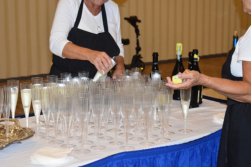 Glasses are filled to toast Alice and Murray Bluegrass.