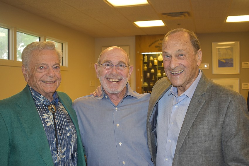 Marvin Morse, Andy Maass and Alan Sprintz wait in the buffet line.