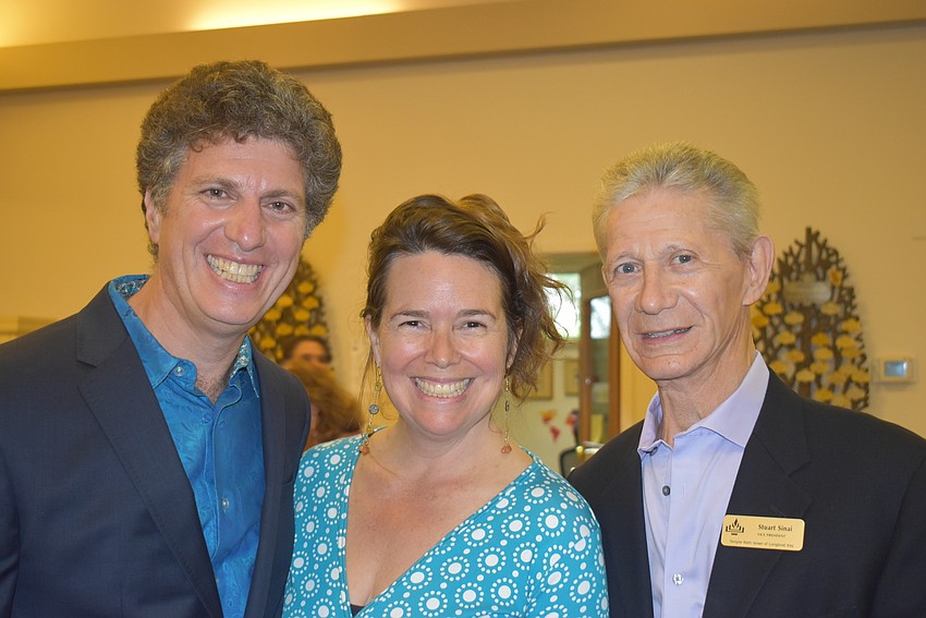 Lee and Lisa Mirman pose with Stuart Sinai.