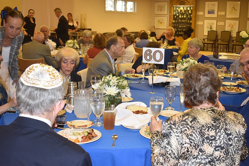 People make conversation across the tables.