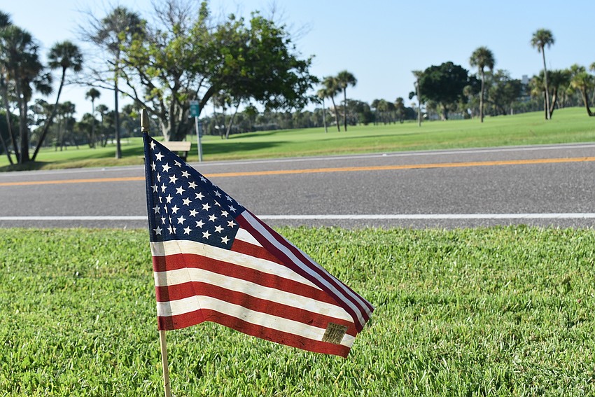 A flag flies along Gulf of Mexico Drive.
