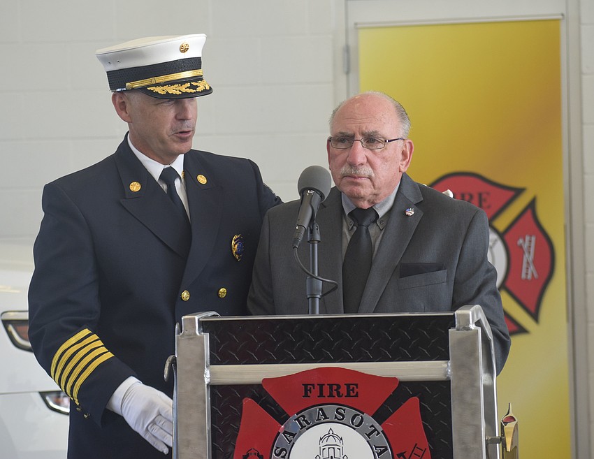 Fire Chief Michael Regnier introduces Norman Schimmel.