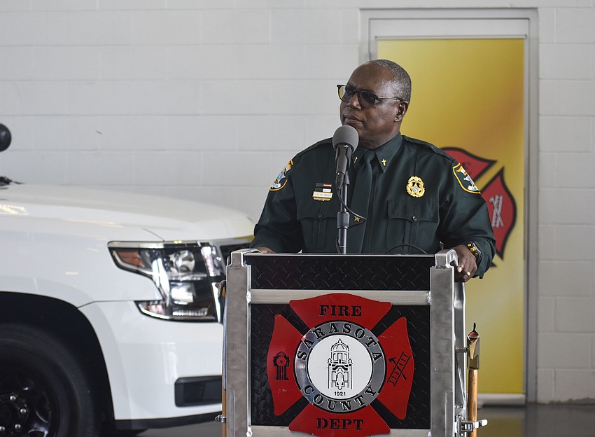 Chaplin John Walker leads the crowd in prayer.