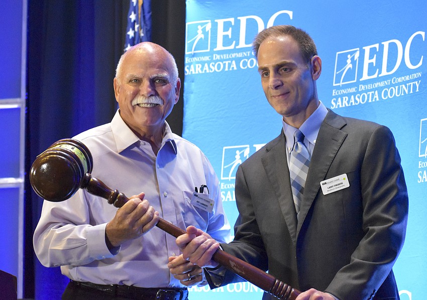Incoming EDC Chair Art Lambert and  Larry Fineberg with the ceremonial gavel.
