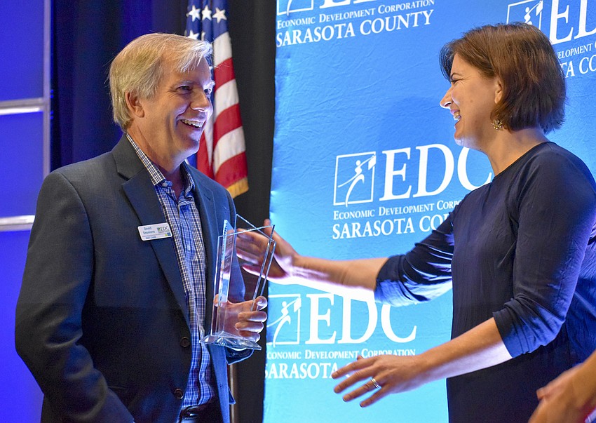 David Sessions accepts the  Clyde Nixon Business Leadership Award from Bradley Nixon.