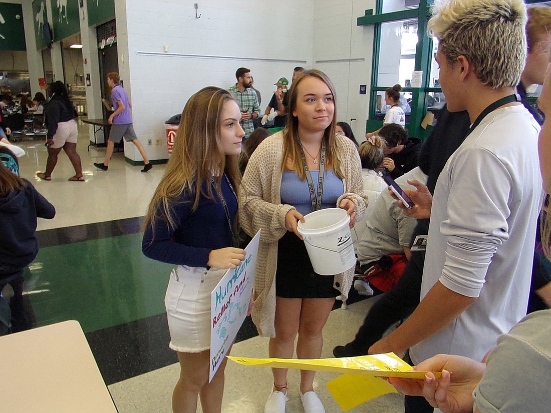 Lakewood Ranch High seniors Faith Kurtz  and Kaylee Eckelman collect donations from students during lunch. Photo courtesy of Jaime Gutierrez.