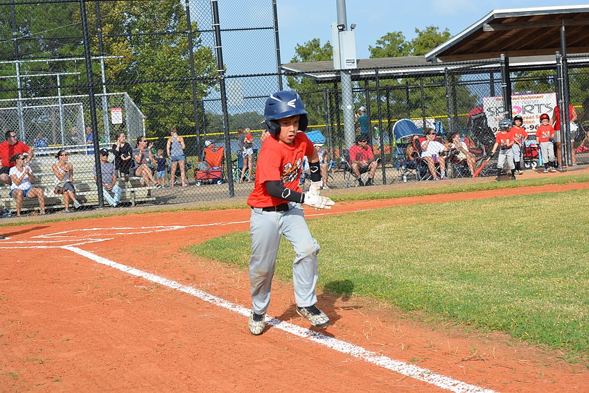 Eight-year-old Jack Morrow makes it to second base on his first at-bat.