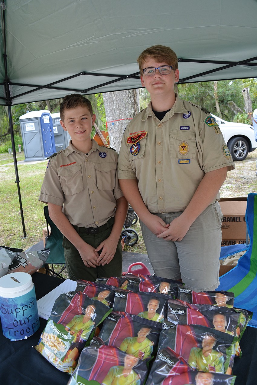 Bradenton 11-year-old Bradley Jordan and Lakewood Ranch High School sophomore Jacob Cole sell popcorn at the event to benefit the Boy Scouts of America Southwest Florida Council Troop 10.