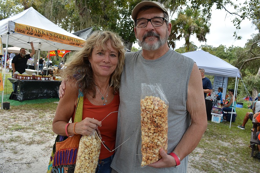 Palmetto's Donna and Mark Levesque try regular and caramel toffee kettle corn.
