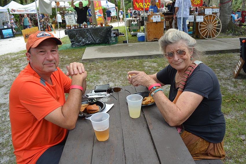 Lakewood Ranch's Chris Kean meets Sarasota's Paula Sharpe as they feast on beer and barbecue.