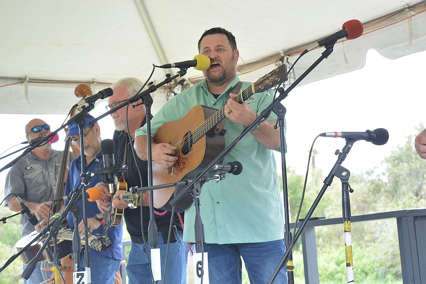 Guitarist Justin Lanier of Blast of Grass delights the crowd with his vocals.