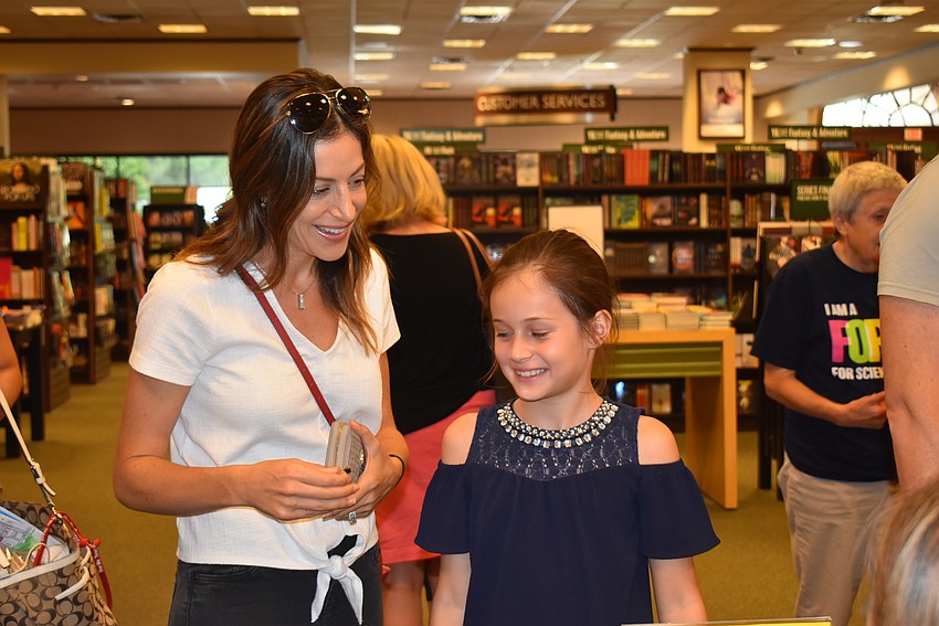 Andrea and Lila Paul get ready to start an afternoon of books.