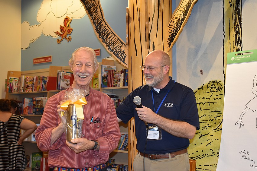 Frank Remkiewicz received a gift from Pine View principal Stephen Covert.