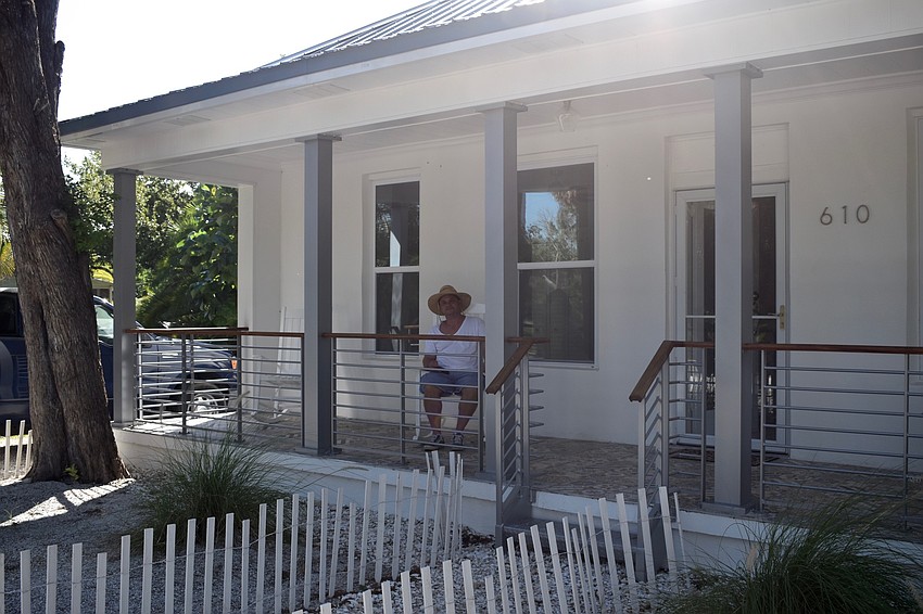 James Sebastiano on the porch of the historic home.