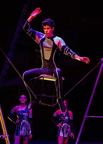 Jared Gracia-David performs wire walking with the Sailor Circus. Photo by Cliff Roles